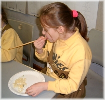 Eating rice with chopsticks
