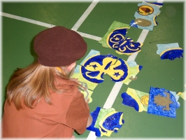 Putting together a jigsaw of old World and Promise badges