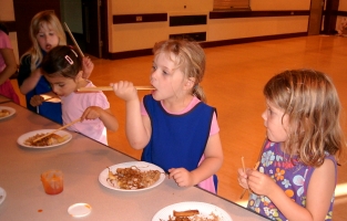 Eating food with chopsticks